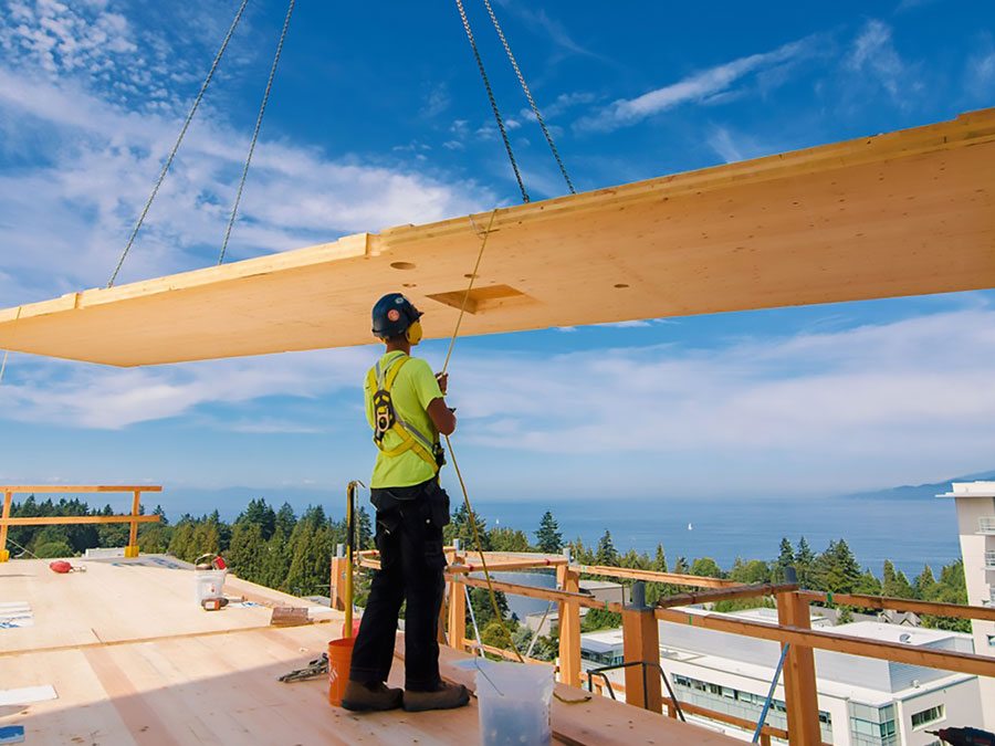 Construction worker with mass timber.