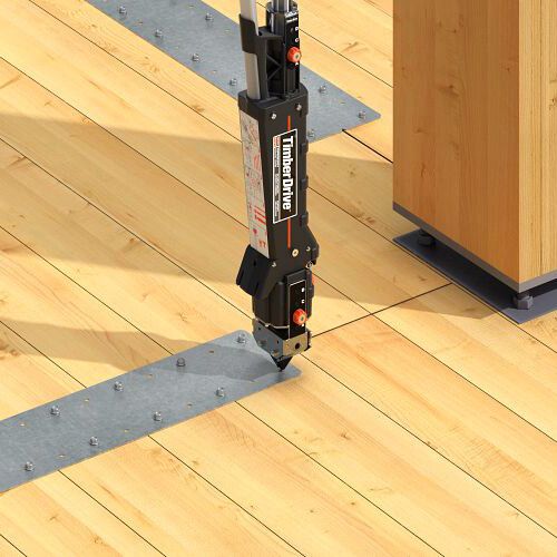 Quik Drive® Cordless PRO300SG2 autodriving screws into metal plate and wooden floor.