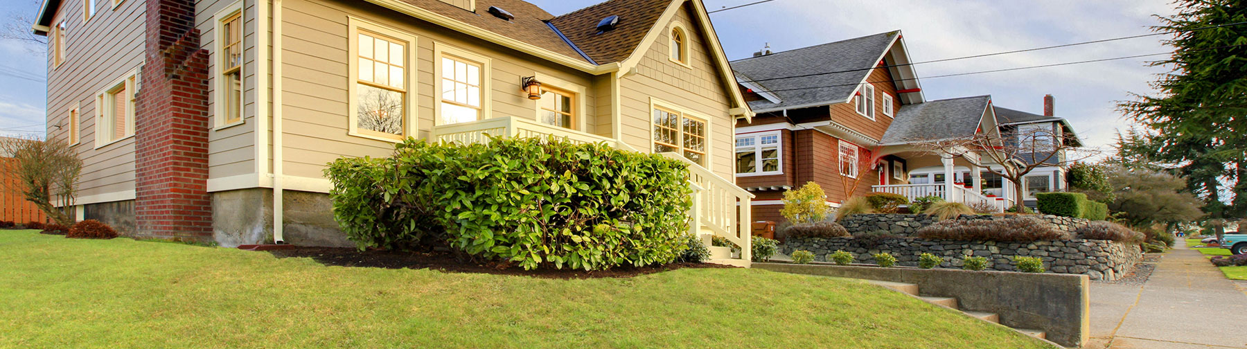 Row of houses with raised foundations on street