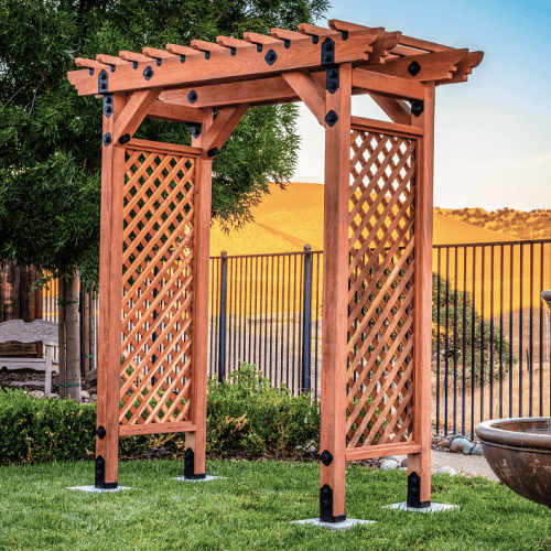 Wood garden lattice arbor on grass.