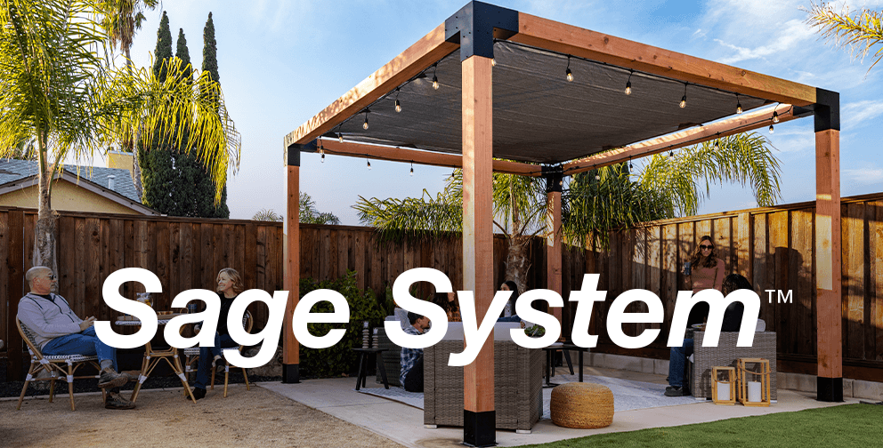 People enjoying a stylish backyard pergola built with the Sage System™ by Simpson Strong-Tie, featuring wooden posts, modern accents, and cozy seating.