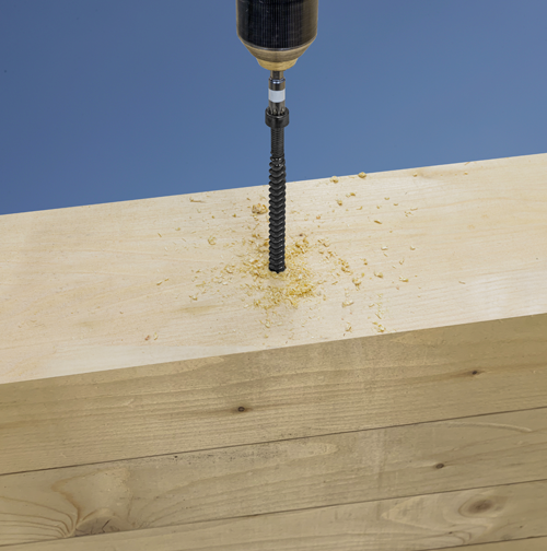 Strong-Drive® SDCFC TIMBER-CF Screw being screwed into wooden plank.